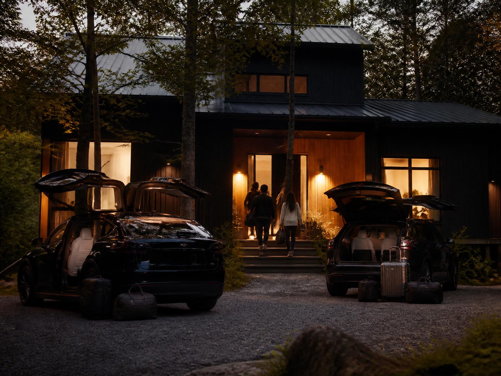 Black Tesla Model X caravan at a Catskills Airbnb driveway